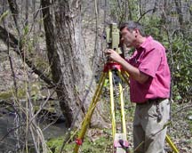 Barry E. Sakal, surveying woodlands